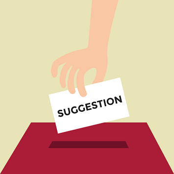 An illustration of a hand placing a suggestion in a suggestion box