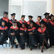 A group of AIMS graduates in caps and gowns