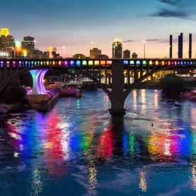 Bridges over the Mississippi River display rainbow lights during Pride Month