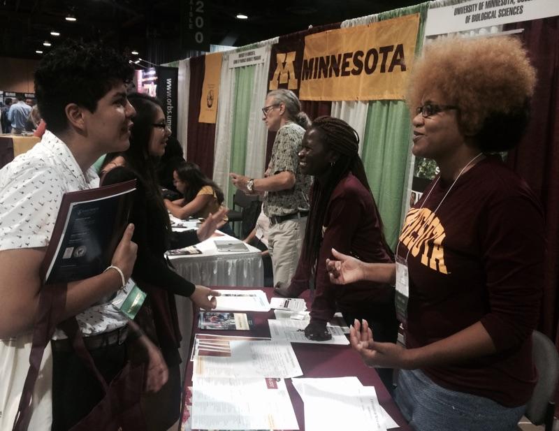 Interacting with potential grad students at recruitment fair