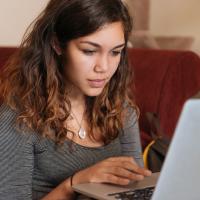 Young woman working at laptop